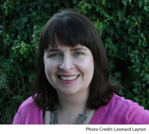 Gabrielle Prendergast in front of a green background